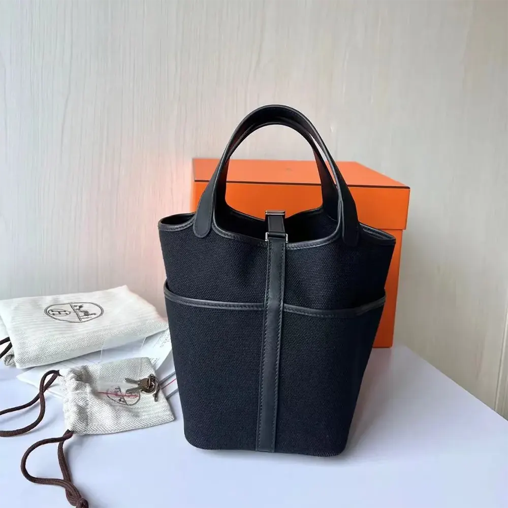 Side angle showing compact silhouette and leather trim of Hermes Women Picotin Lock