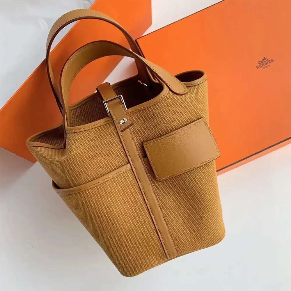 Close-up of gold-tone lock on Hermes Women Picotin Lock 18 Pockets handbag
