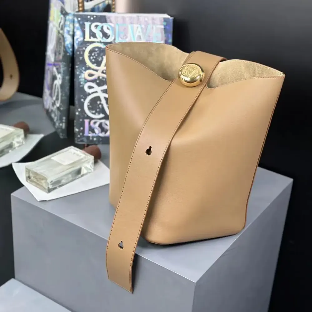 Side angle showing adjustable strap and drawstring closure on Loewe bag
