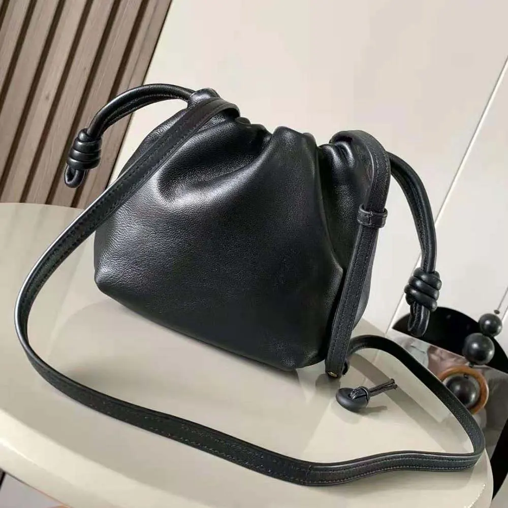 Side angle showing compact silhouette of Loewe Women Mini Flamenco Purse Bag