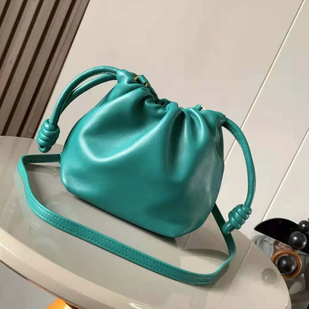 Side angle showing compact silhouette of Loewe Mini Flamenco Purse Bag