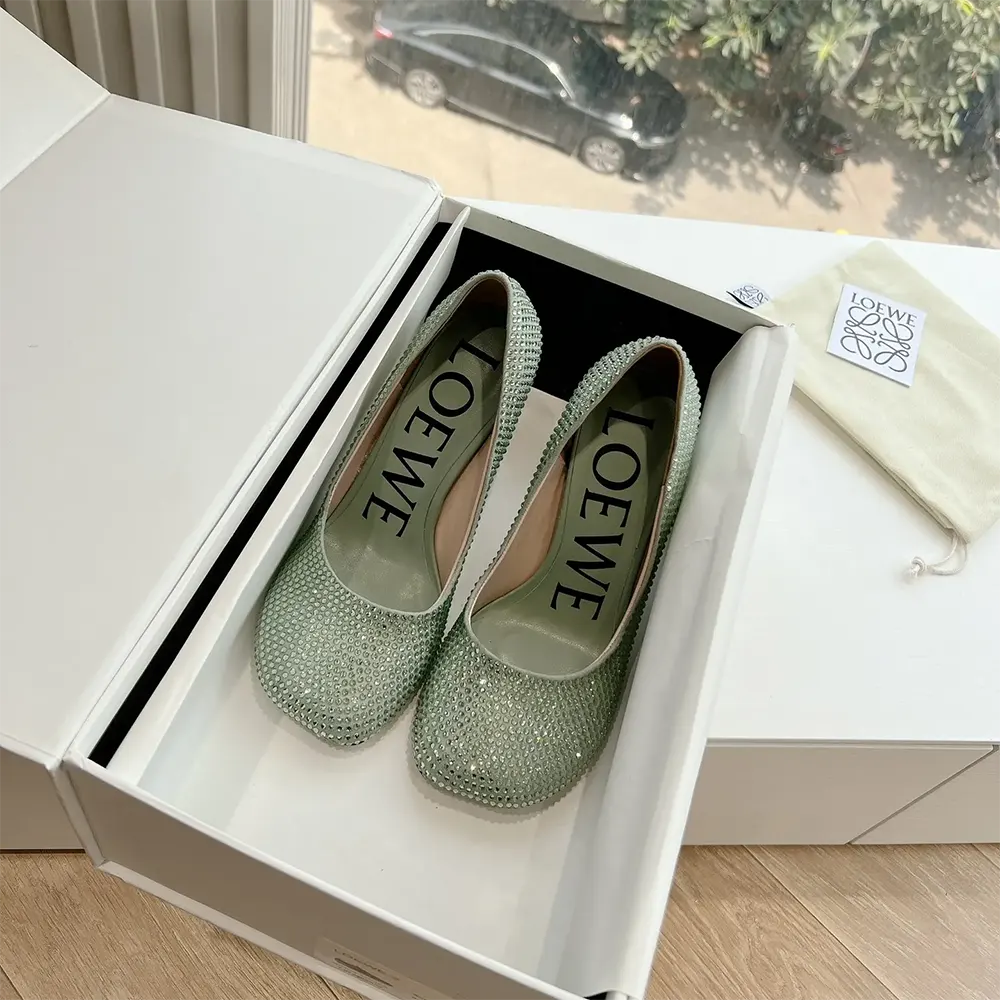 Close-up detail of rhinestones on Loewe Women Toy Pump in Lime suede