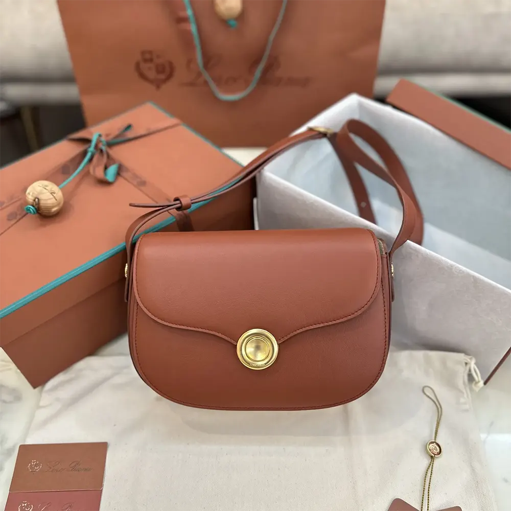 Close-up of brown suede and gold-tone Ghiera closure on Mini Ghiera Bag