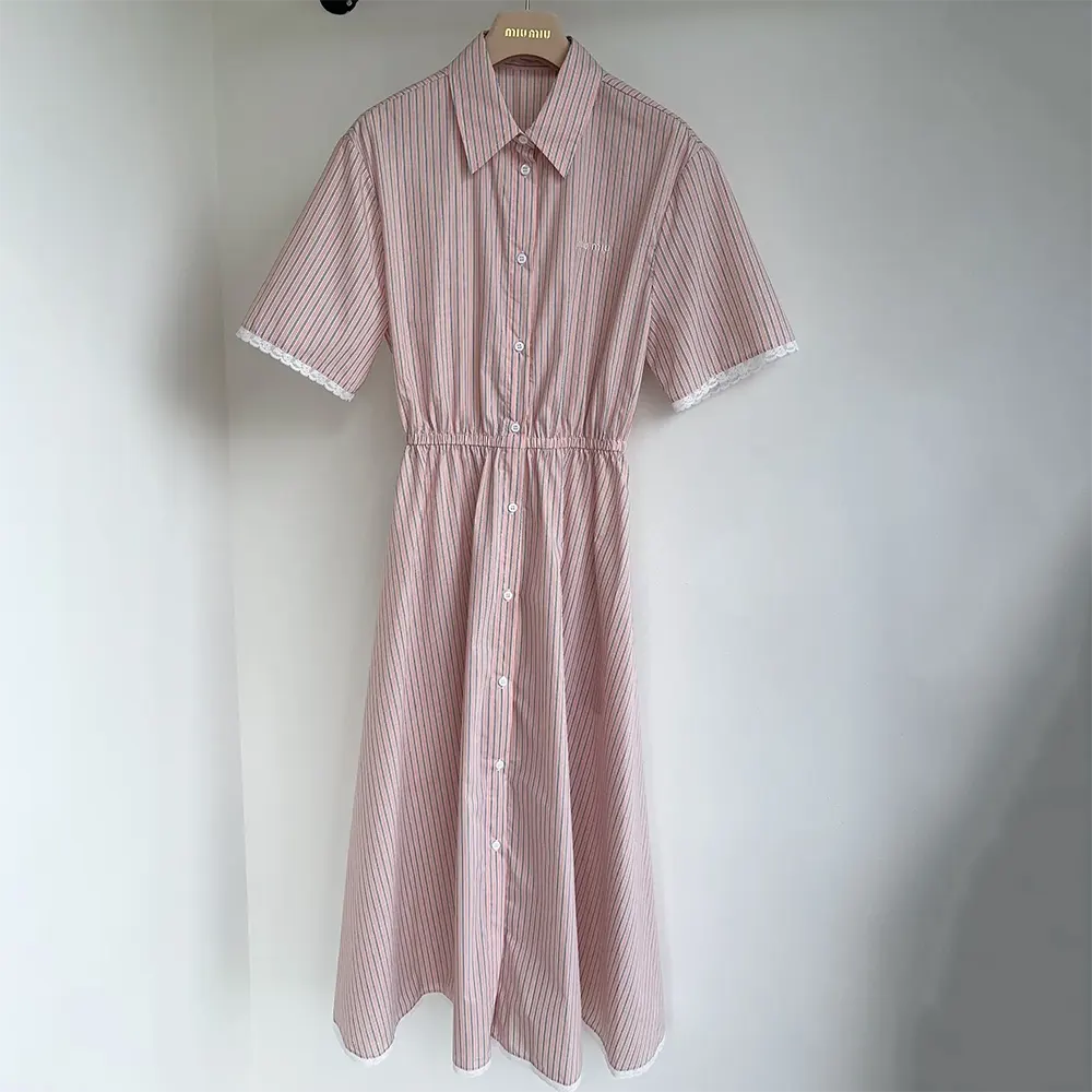 Close-up of embossed buttons on Miu Miu Women Cotton Dress