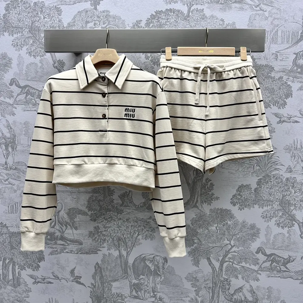 Close-up detail of Miu Miu cotton fleece fabric and buttons