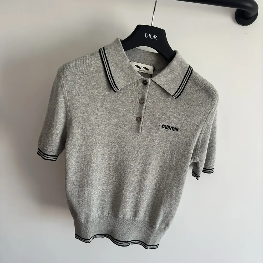 Side angle showing slim fit of Miu Miu Women Cotton Jersey Polo Shirt