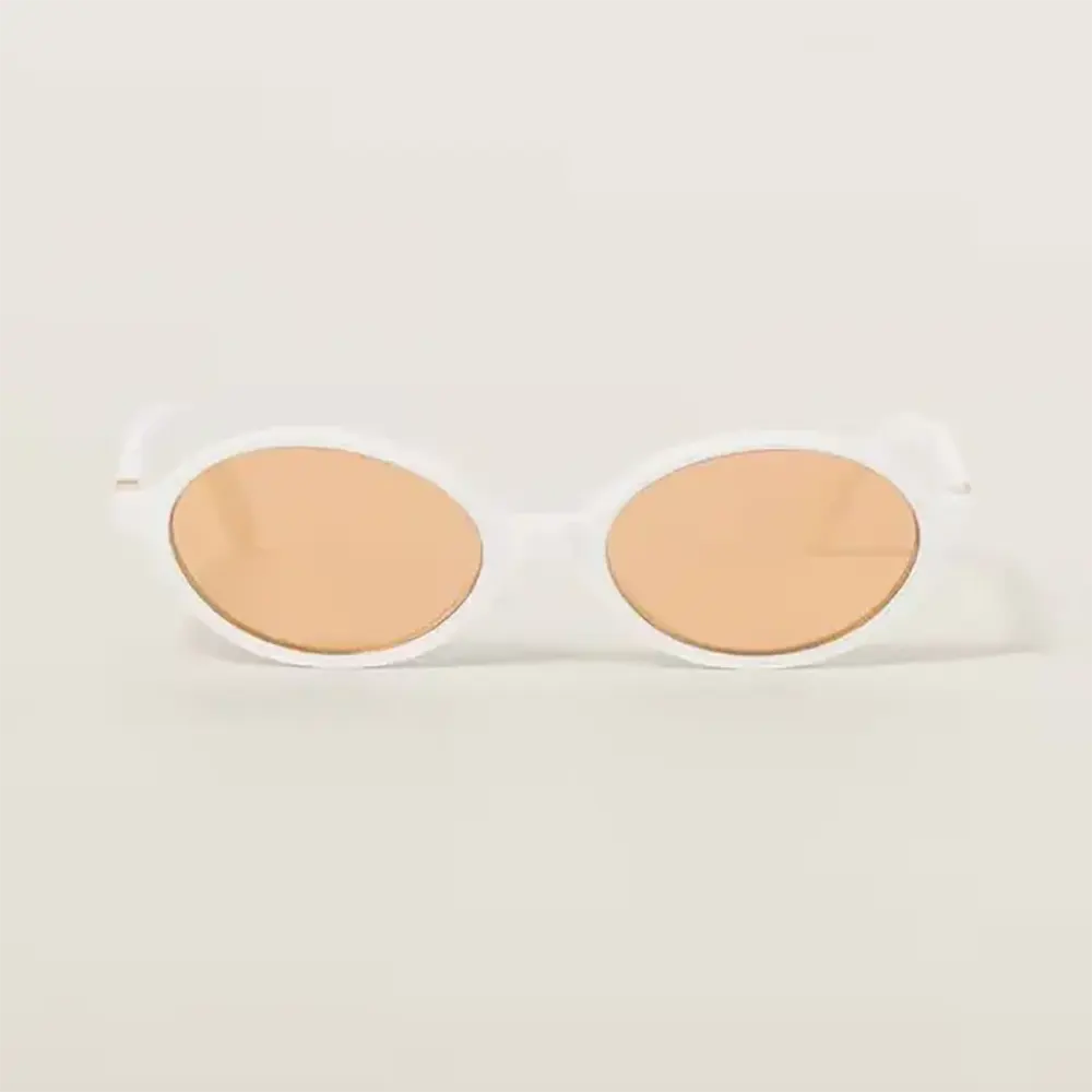 Close-up of gold-tone logo detail on Miu Miu Women Regard Sunglasses