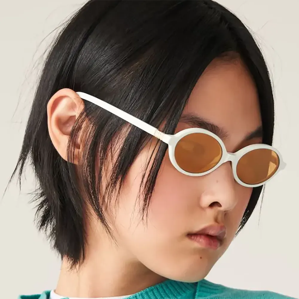 Side angle showcasing silhouette of Miu Miu Women Regard Sunglasses black acetate