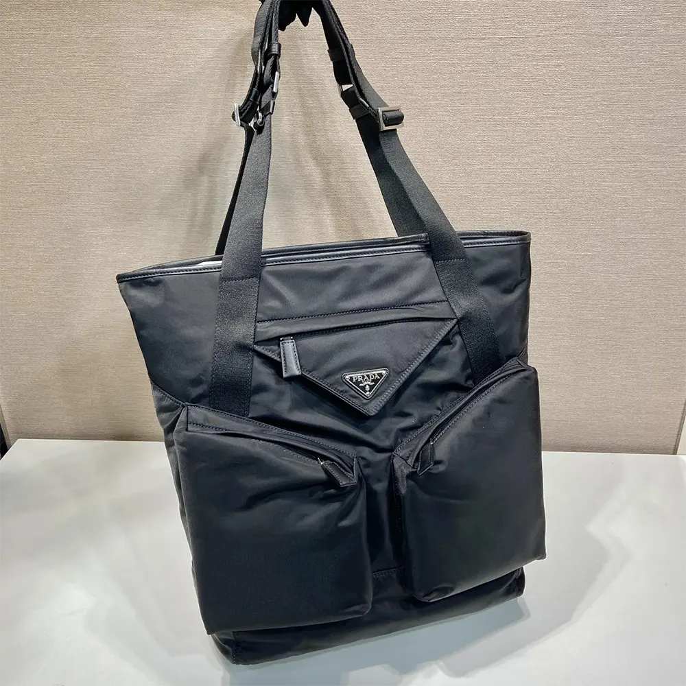Close-up of silver hardware on Prada Men Re-Nylon and Leather Tote Bag-Black