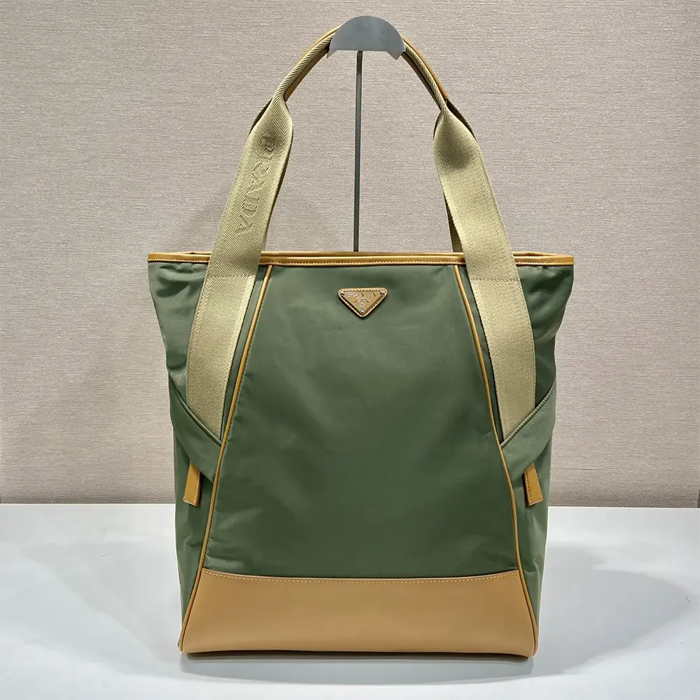 Close-up of leather trim and Prada logo on tote bag