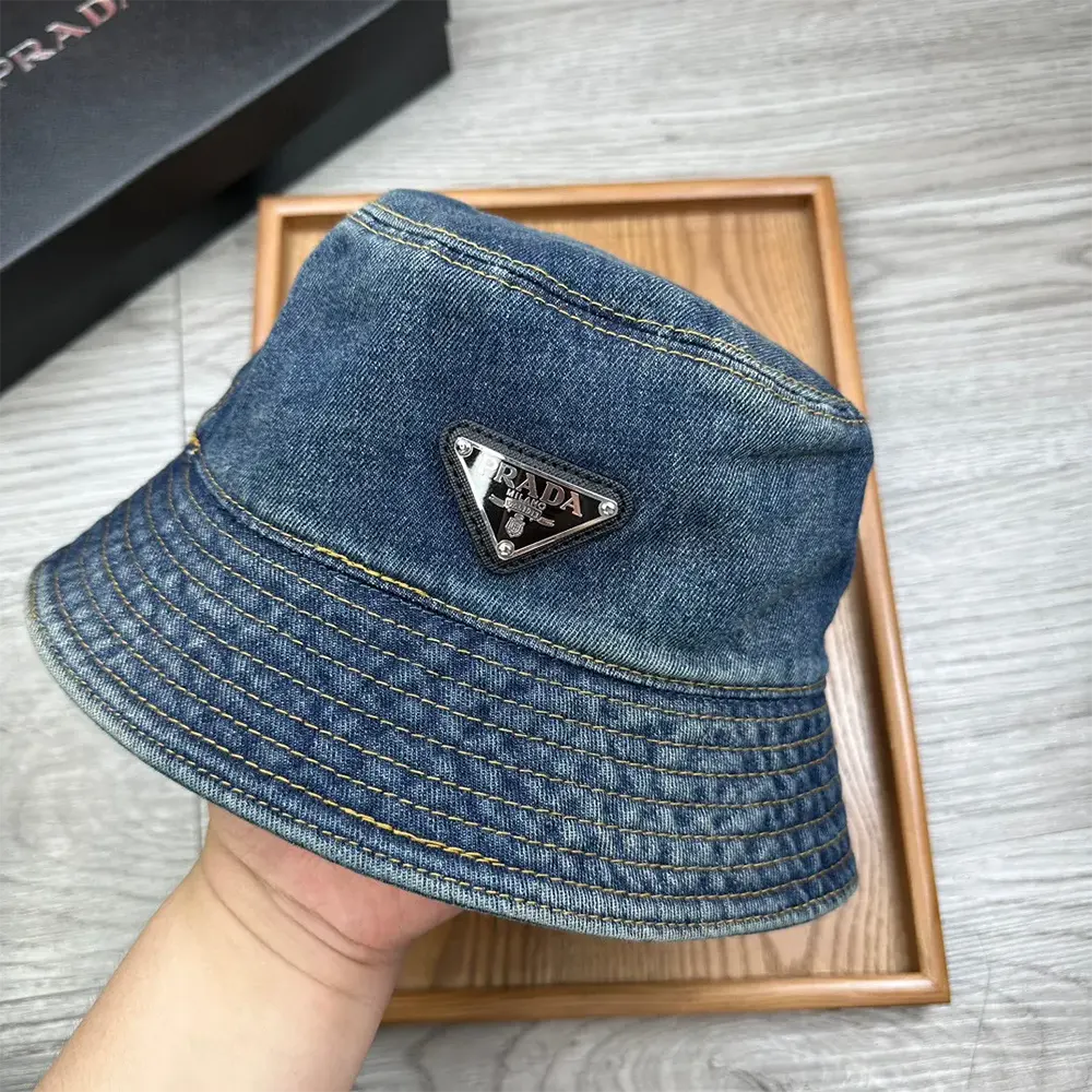Side angle of Prada Unisex Denim Bucket Hat-Blue with visible stitching
