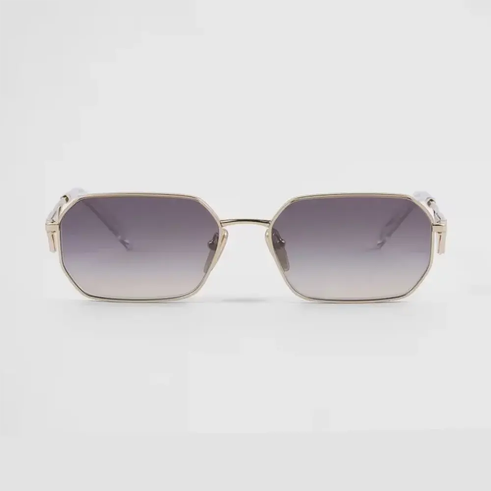 Close-up of gold Prada triangle logo on sunglasses temple