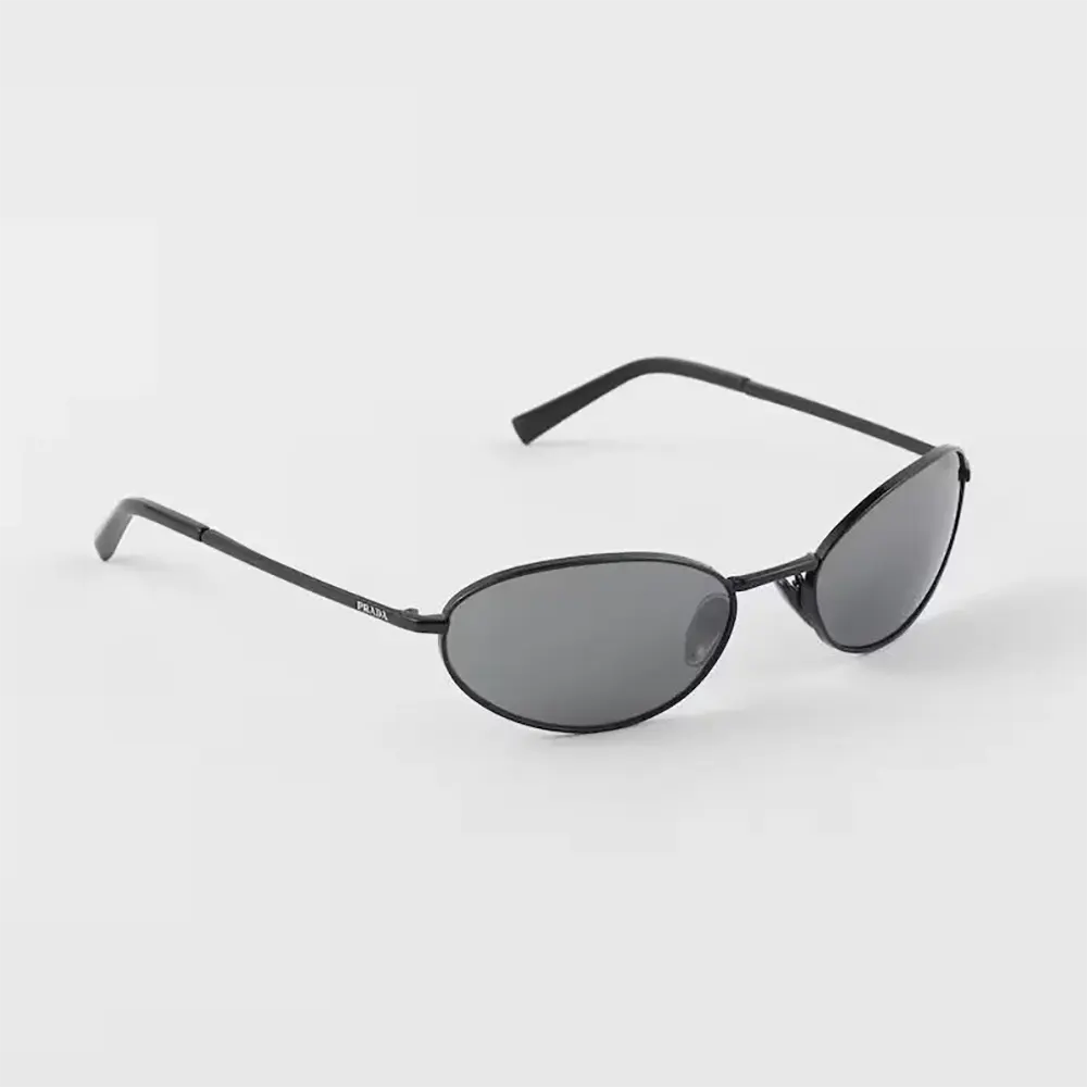 Close-up of Prada logo detail on temple of Prada Unisex Sunglasses