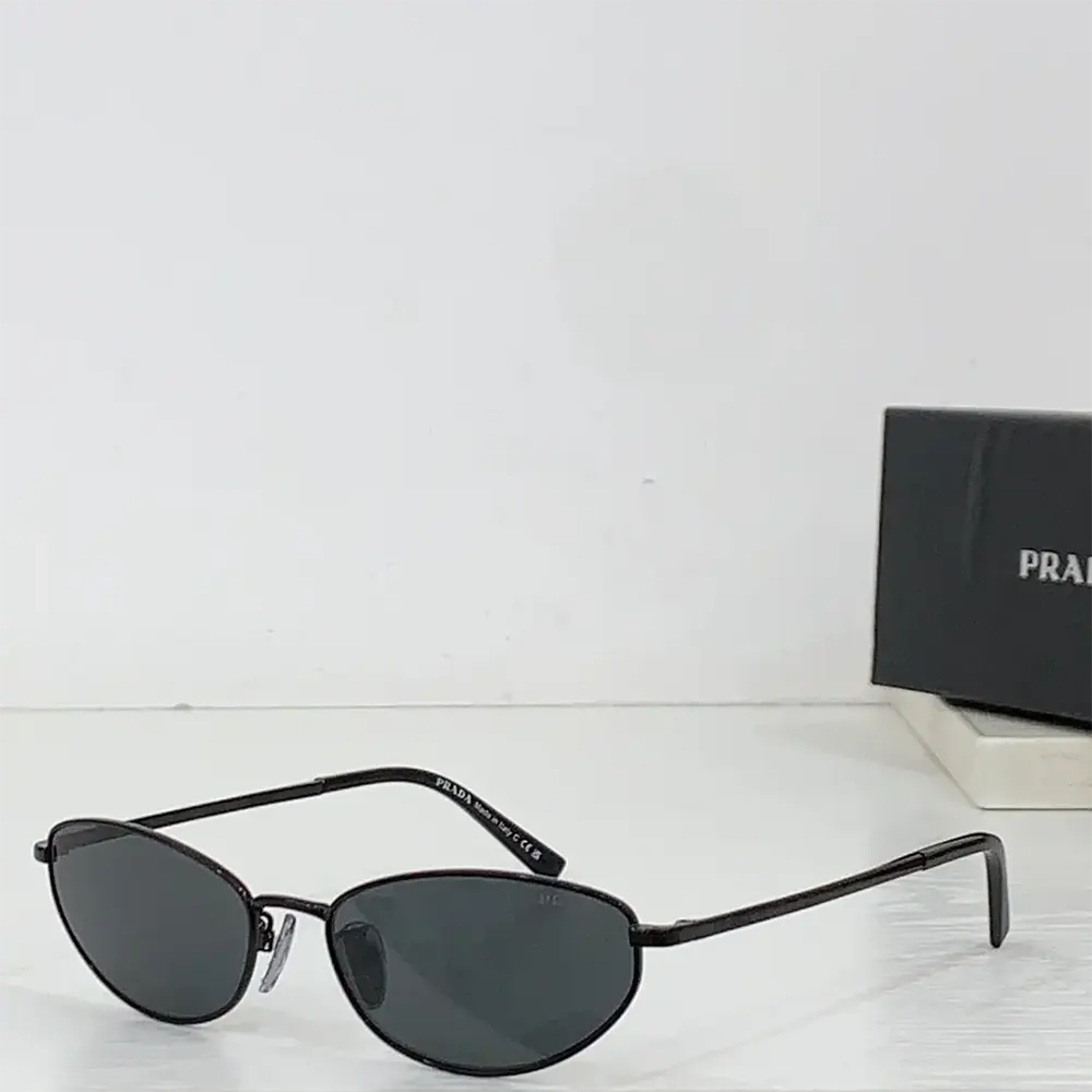 Side angle showing silhouette and frame of Prada Unisex Sunglasses with logo