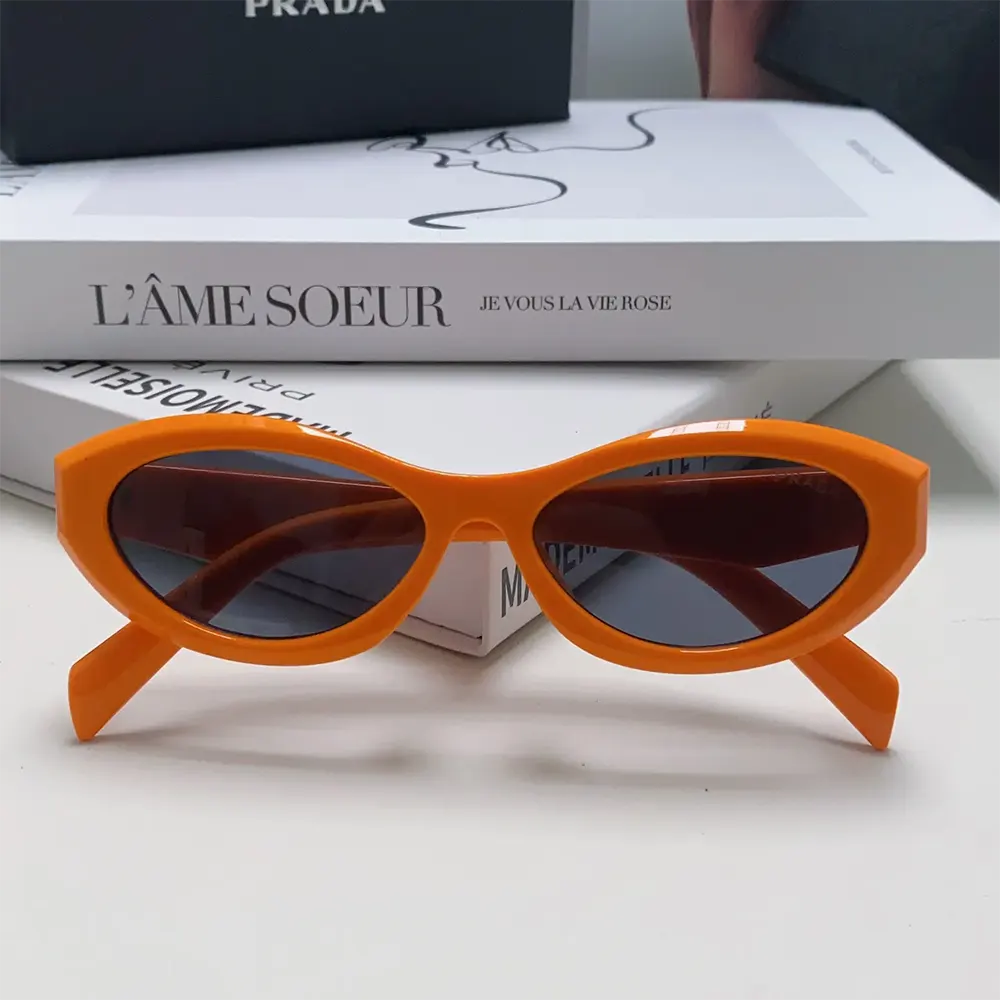 Side angle showing vibrant orange acetate temples on Prada Unisex Symbole Sunglasses-Orange