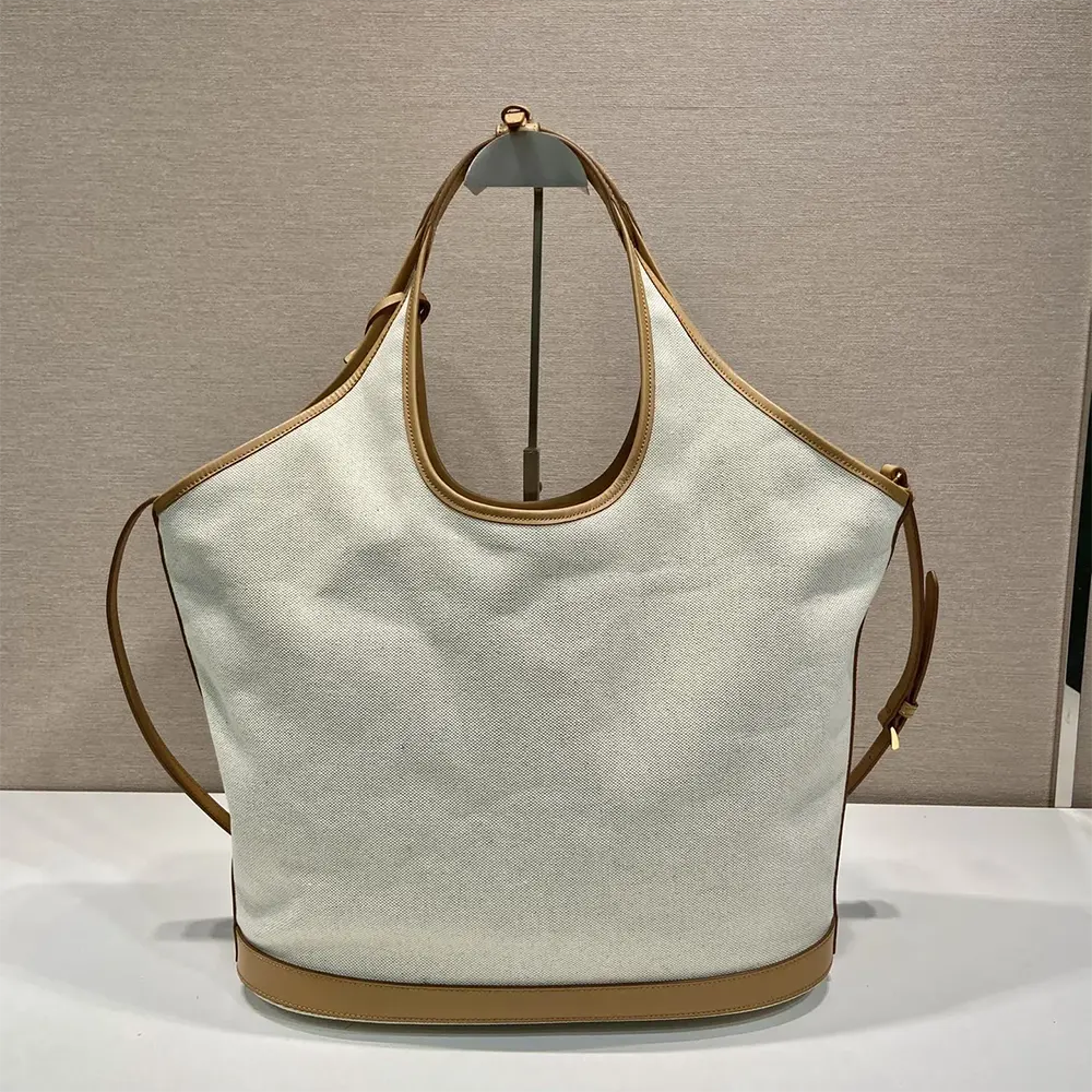 Side angle showing spacious interior and leather trim of Prada Women Large Linen Blend and Leather Tote Bag