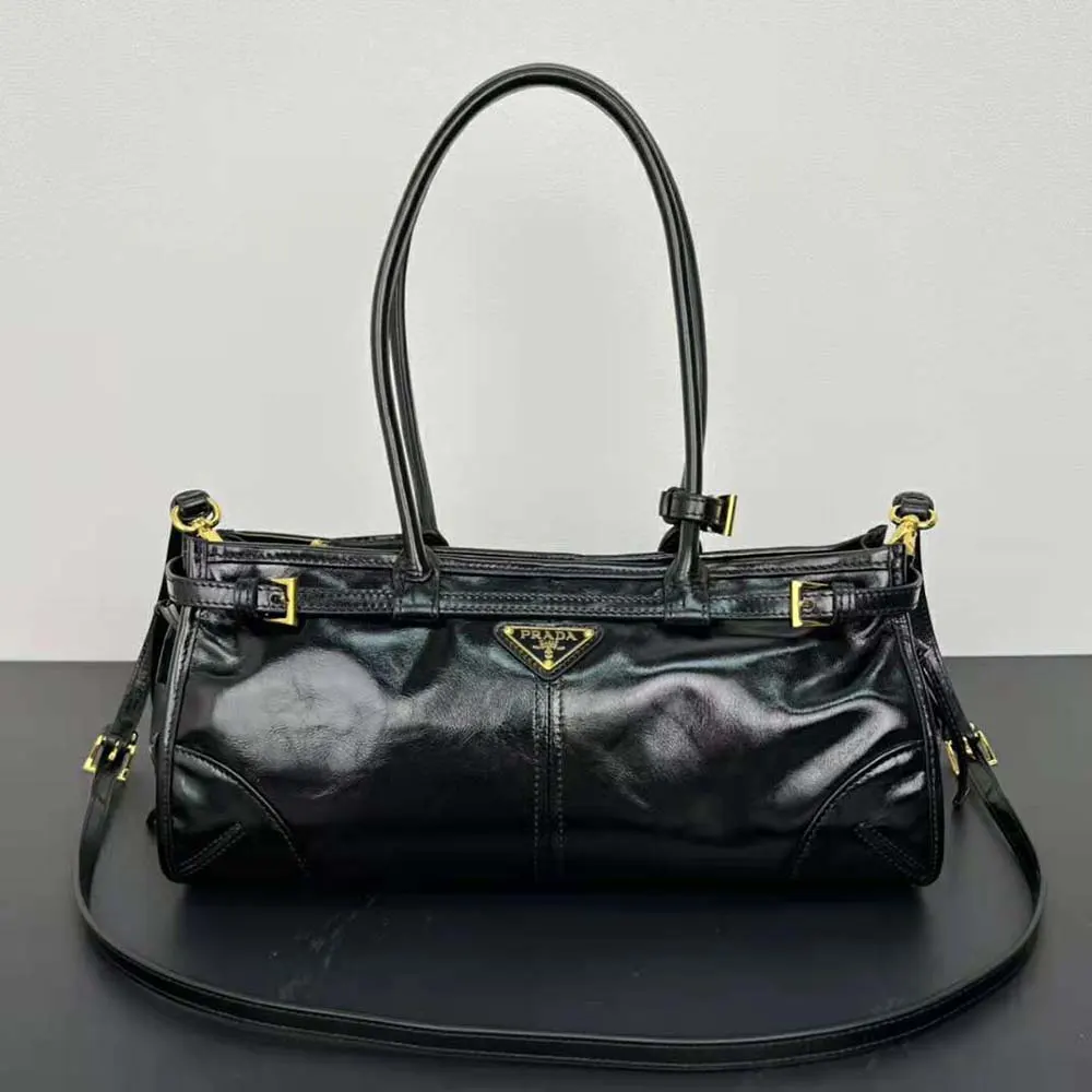 Close-up of silver hardware and leather texture on Prada handbag