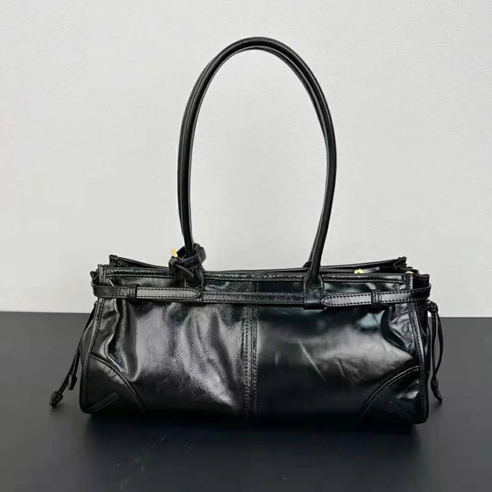 Side angle showing strap and silhouette of Prada Women Medium Leather Handbag-Black