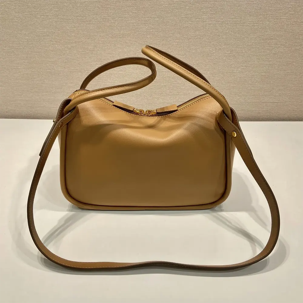 Side angle of Prada Women Leather Handbag-Brown highlighting adjustable strap