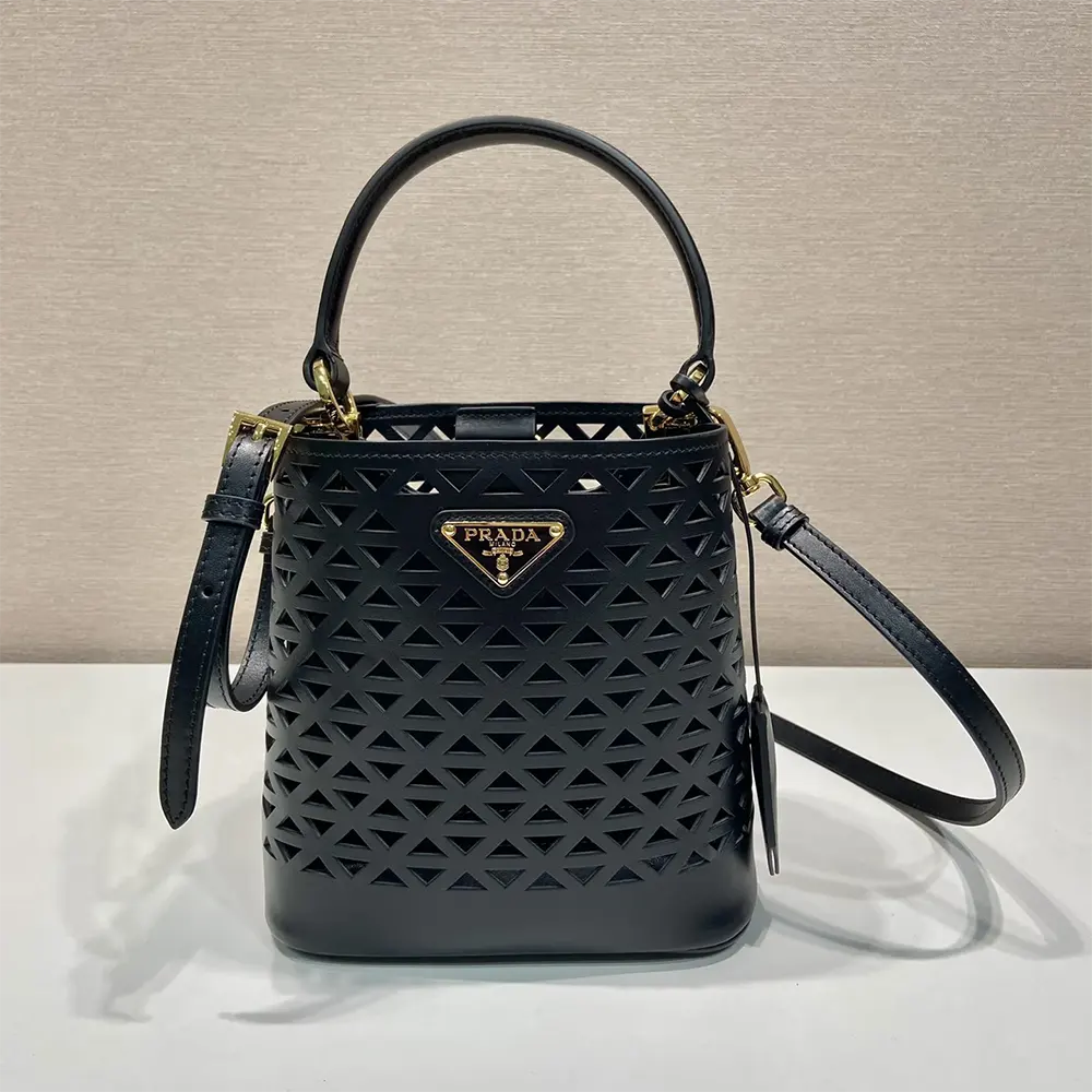 Close-up of cut-out motif and silver hardware on Prada Women Panier Mini-bag