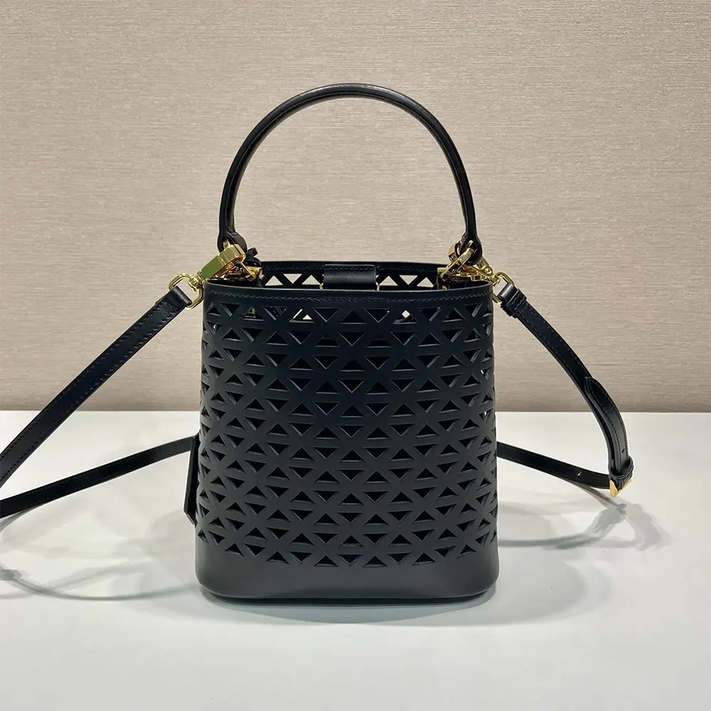 Side profile showing slim silhouette of Prada Women Panier Leather Mini-bag