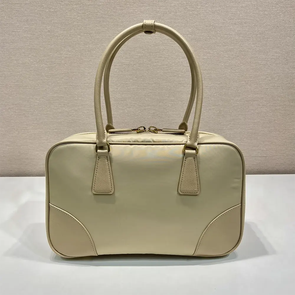 Side profile showing zip closure and sandy Re-Nylon texture