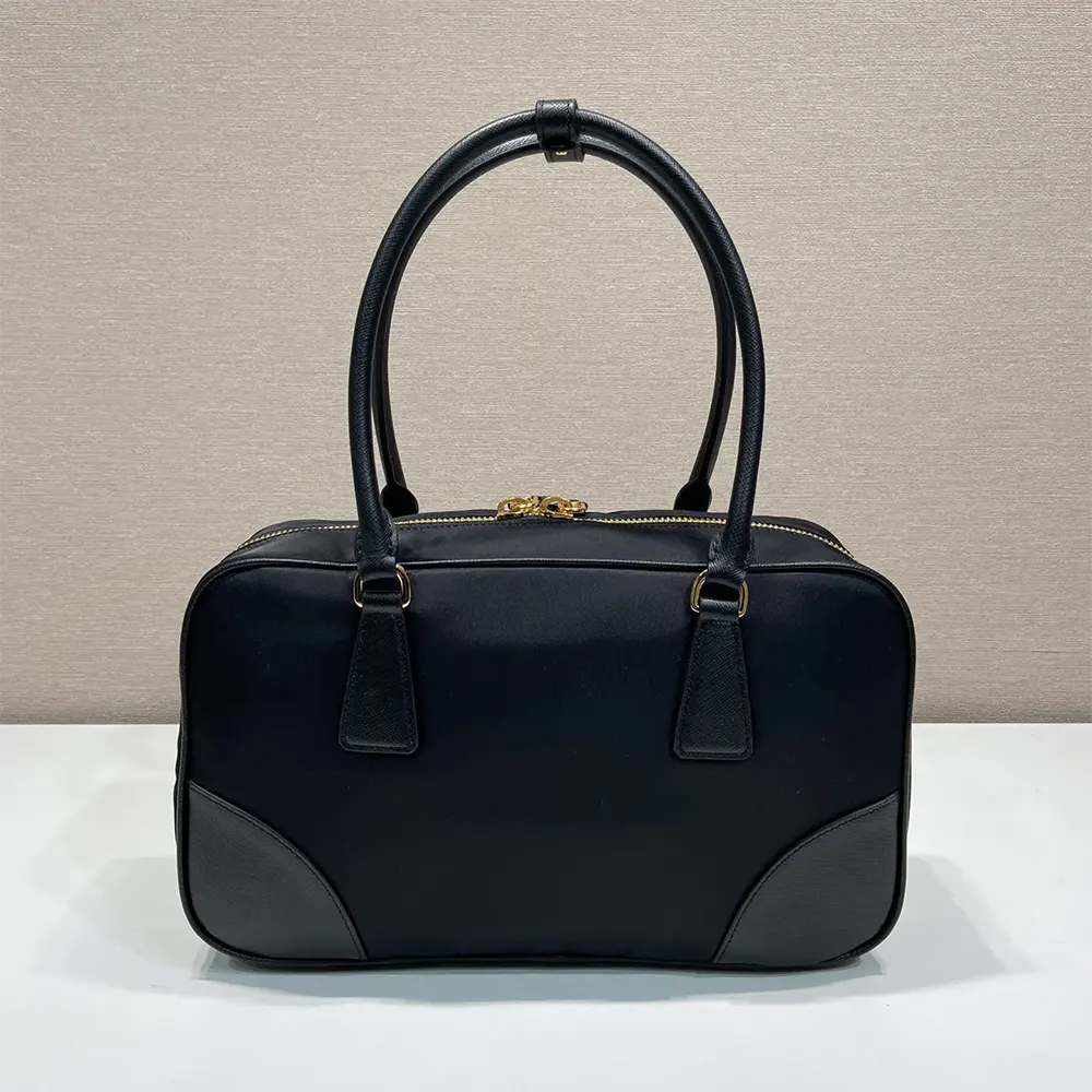 Side angle showing zip closure and structured silhouette of Prada Women Re-Edition 1978 bag
