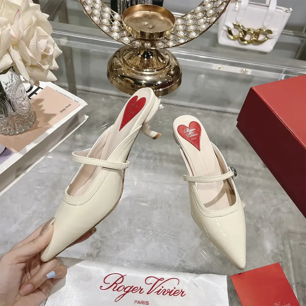 Top view showing glossy patent leather strap on Roger Vivier Women Mary Jane Virgule Mules