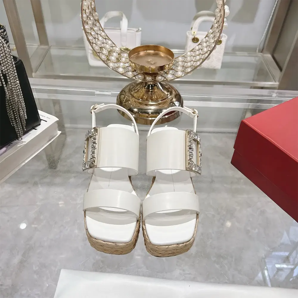 Close-up of strass buckle detail on Roger Vivier Raffia Wedge Sandals