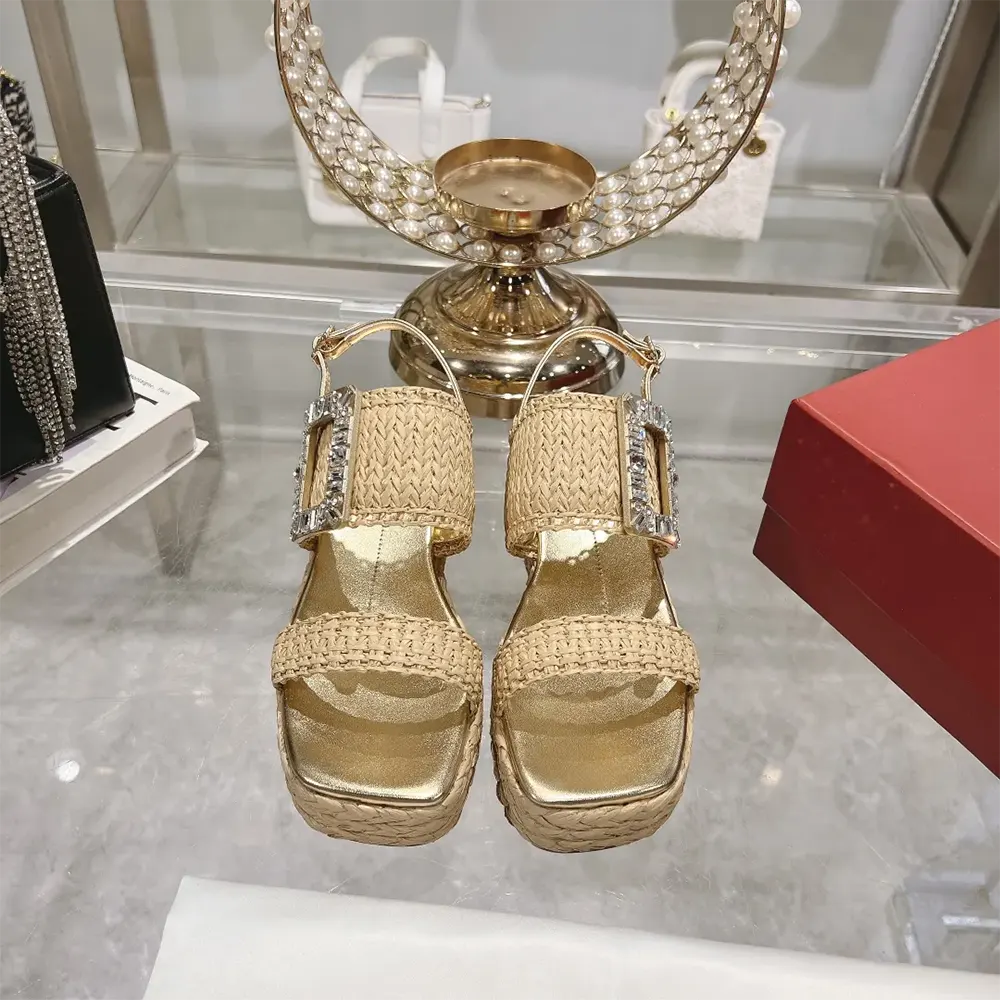 Close-up of sparkling strass buckle on Roger Vivier Raffia Wedge Sandals