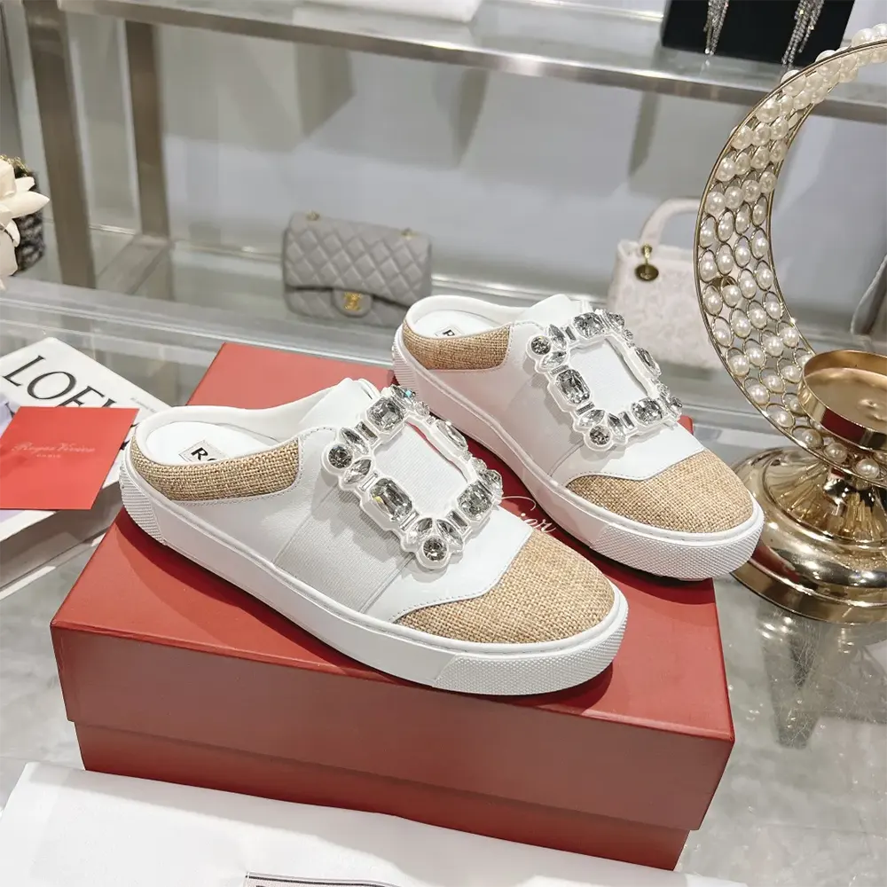 Top view showing white leather and silhouette of Roger Vivier mules