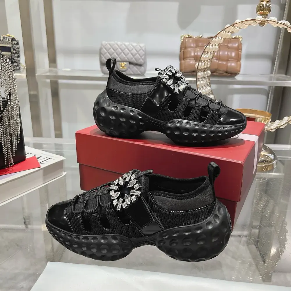 Close-up of signature buckle detail on Roger Vivier Viv’ Run Light Trekky Sneakers