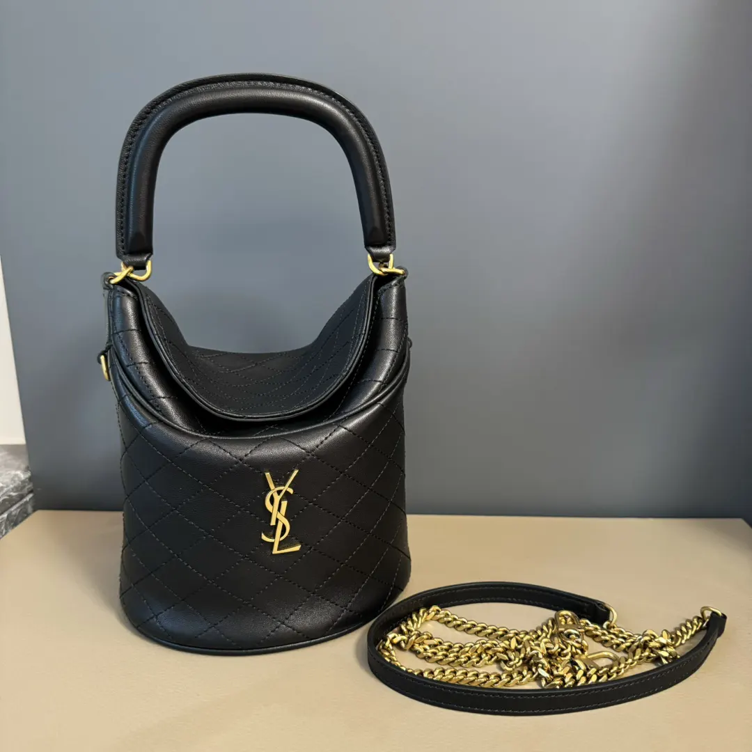 Close-up of gold YSL logo hardware on Gaby Bucket Bag