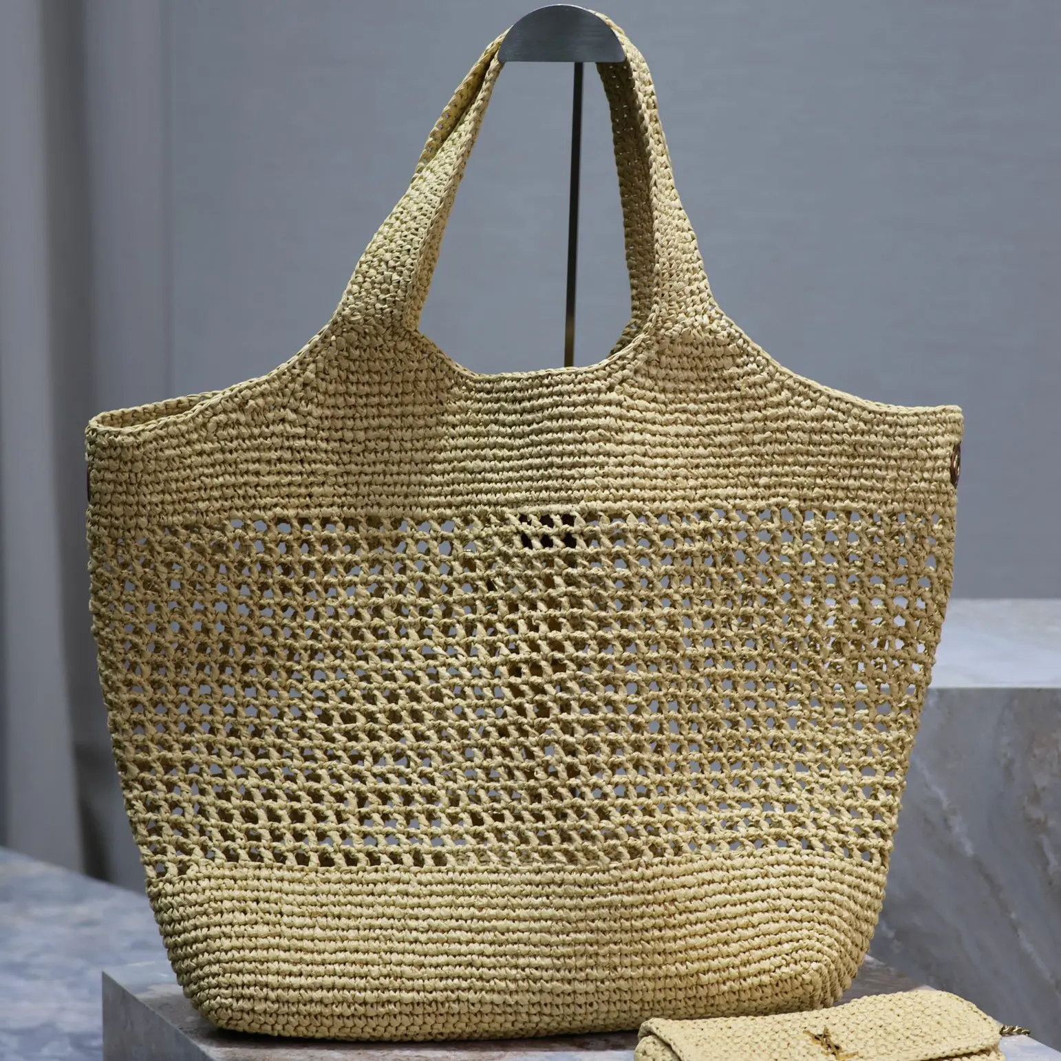 Side profile showing natural raffia texture on Saint Laurent YSL Women Icare