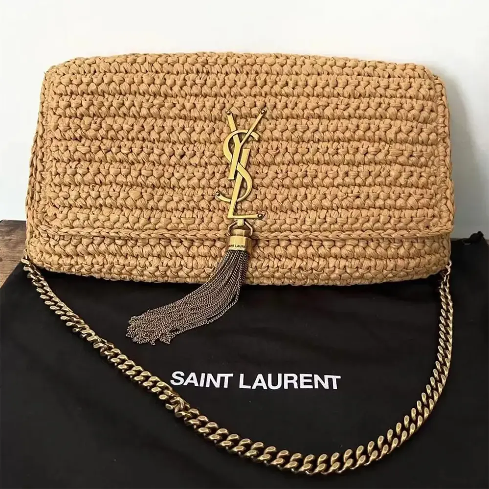 Close-up of gold YSL tassel and raffia weave detail on the bag