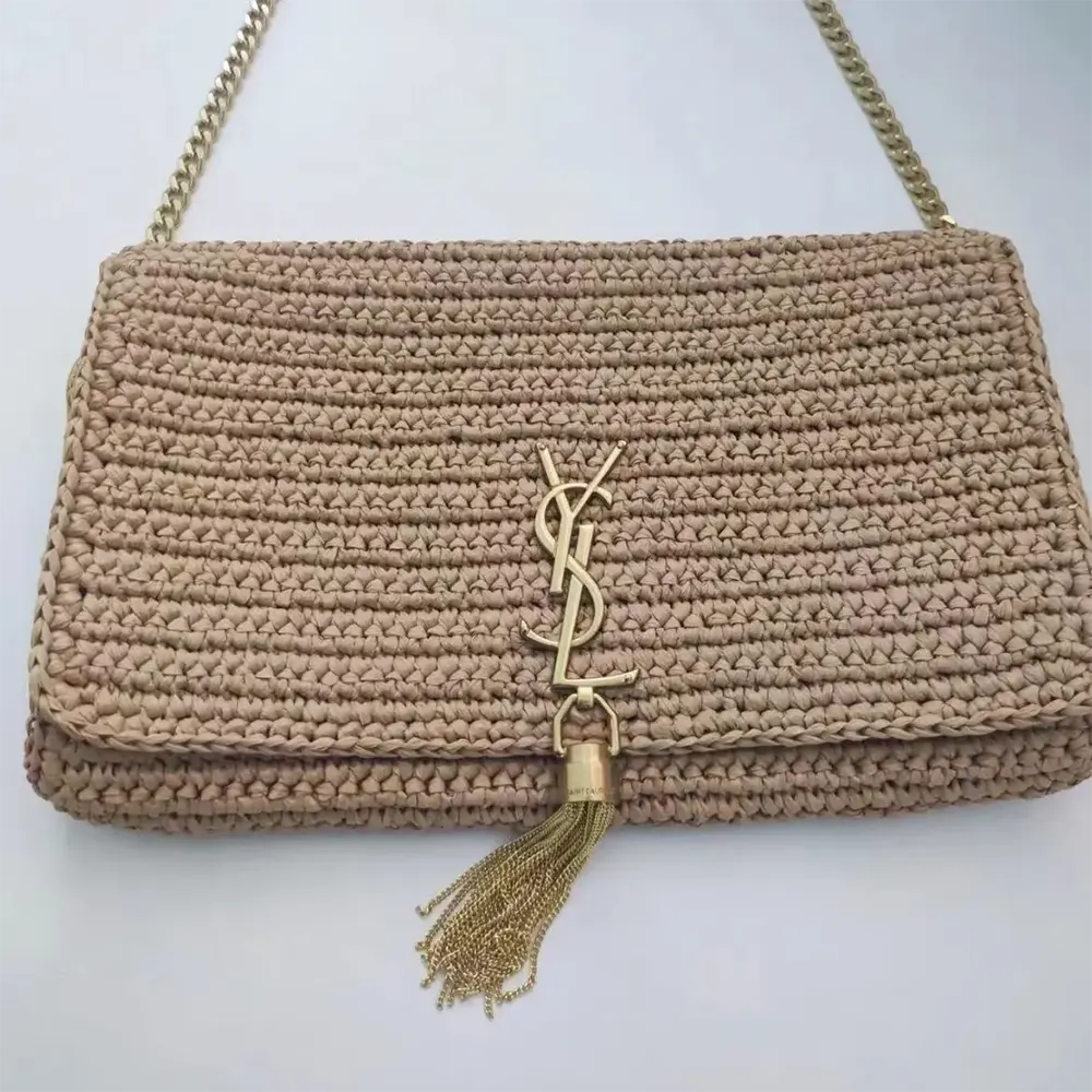 Side profile showing adjustable strap on Saint Laurent YSL Kate 99 Tassel
