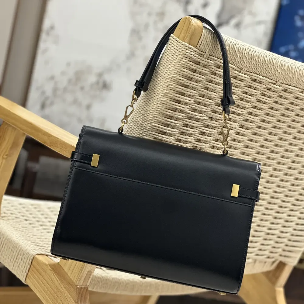 Side angle showing structured silhouette of Saint Laurent YSL Manhattan Top-handle bag