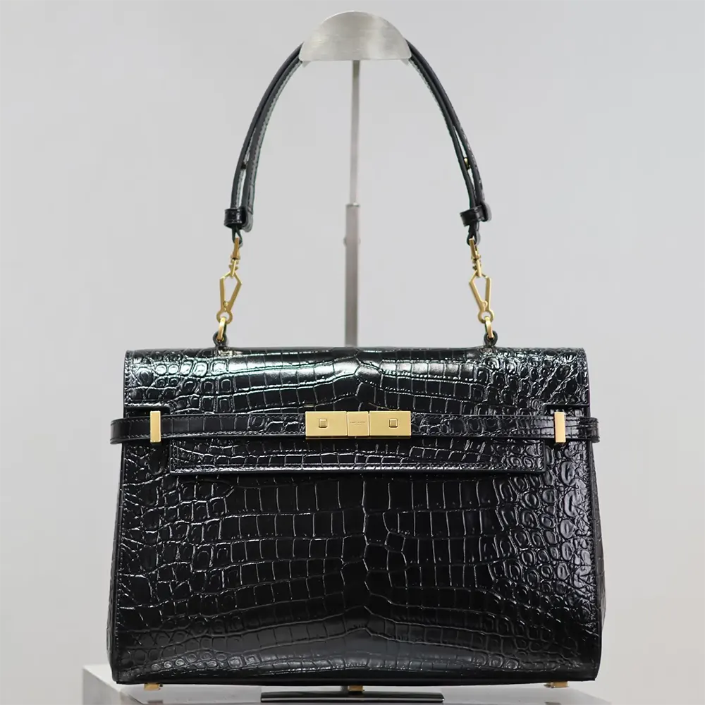 Close-up of gold YSL hardware on Saint Laurent YSL Manhattan bag