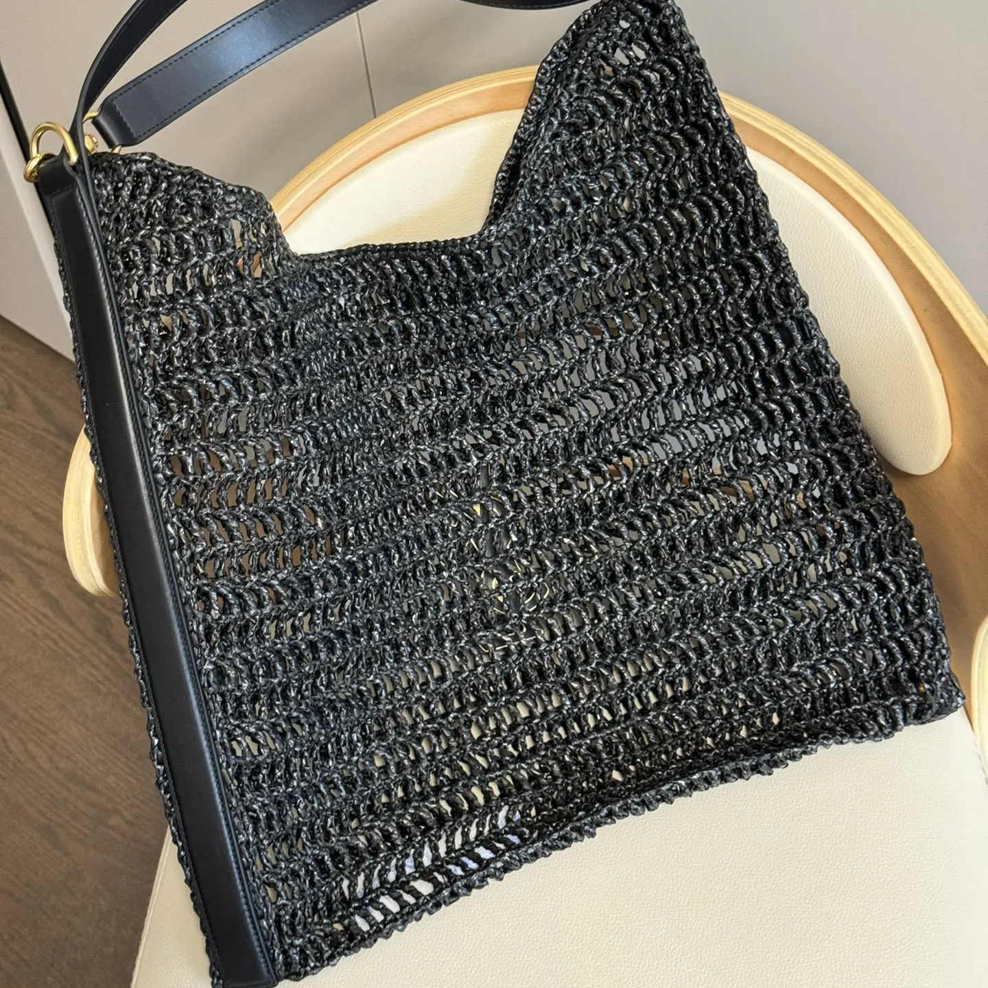 Side profile showing adjustable strap of Saint Laurent Oxalis bag