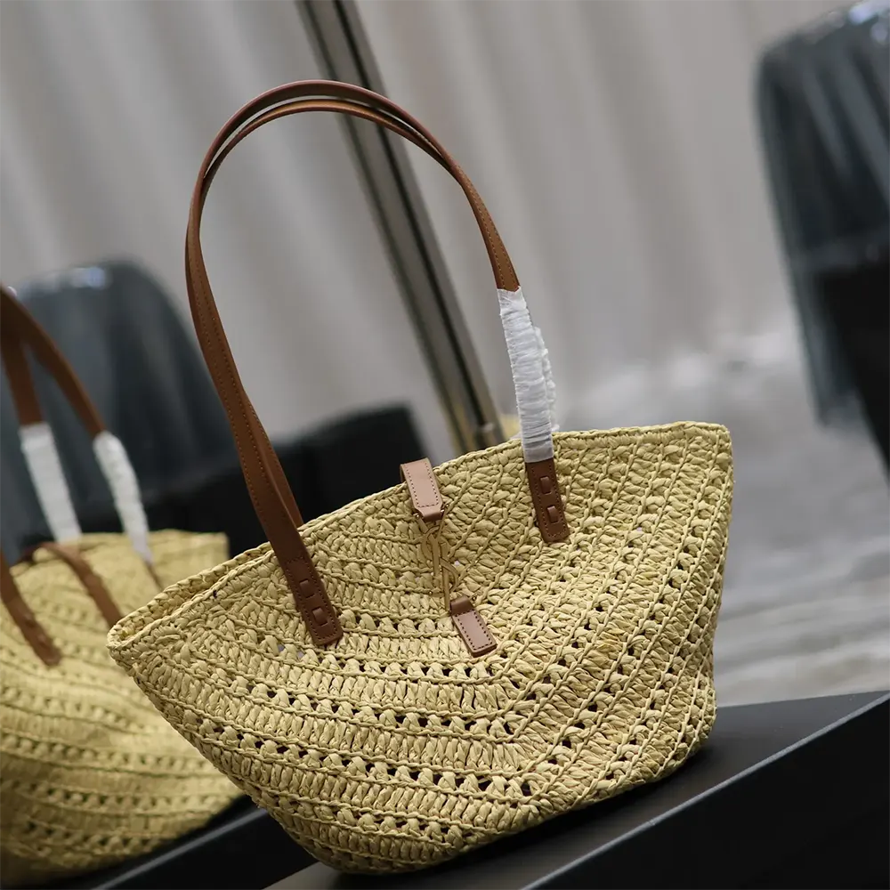 Side angle showing vegetable-tanned leather strap on Saint Laurent Panier bag