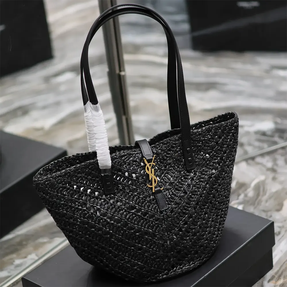 Side angle showing raffia texture and leather trim on Saint Laurent Panier Small