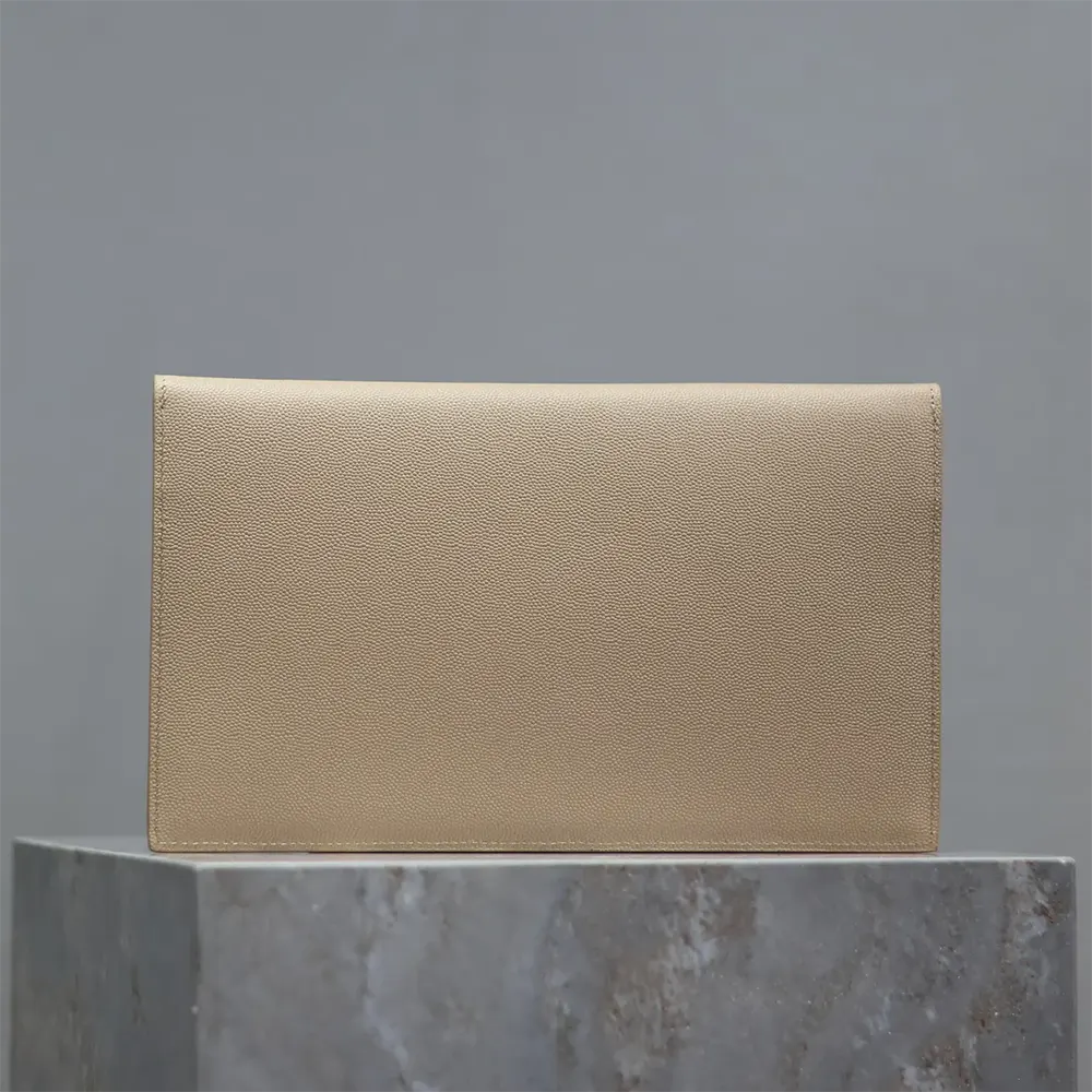 Side angle showing zip closure and texture of Uptown Pouch leather