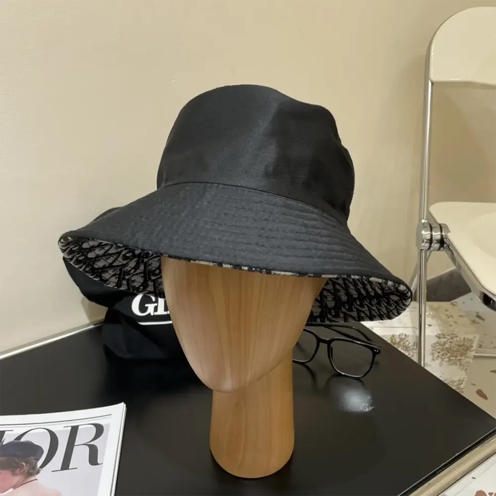 Close-up on embossed Teddy-D logo on black bucket hat