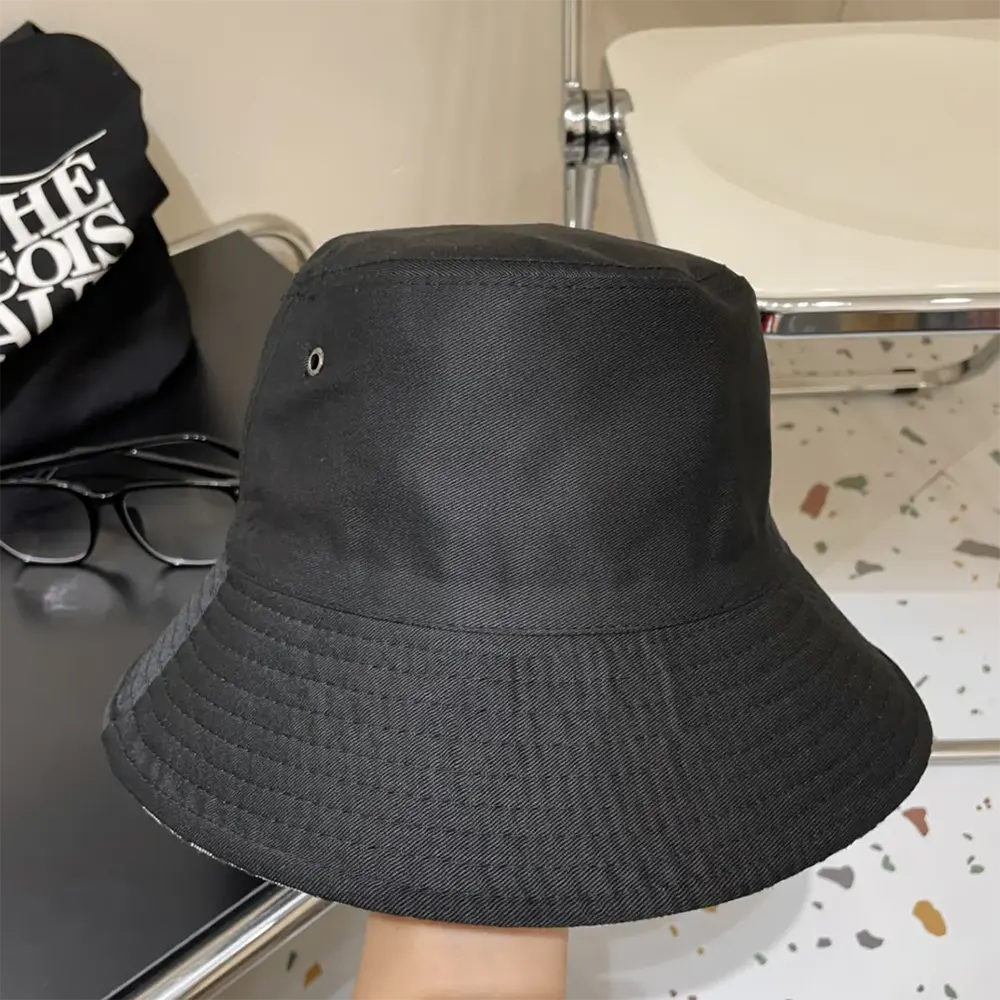 Side view showing reversible design of Dior bucket hat