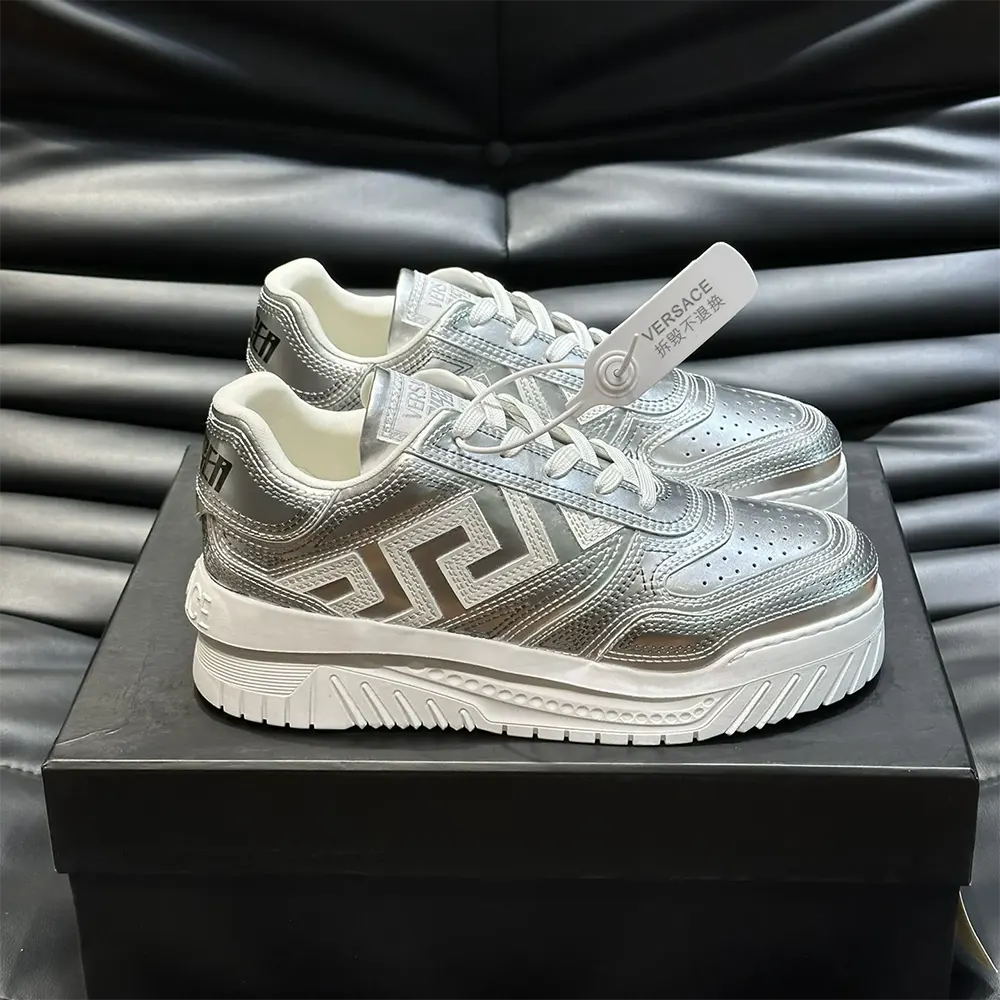 Close-up of Greca embossed detailing on Versace Unisex Metallic Greca Odissea Sneakers