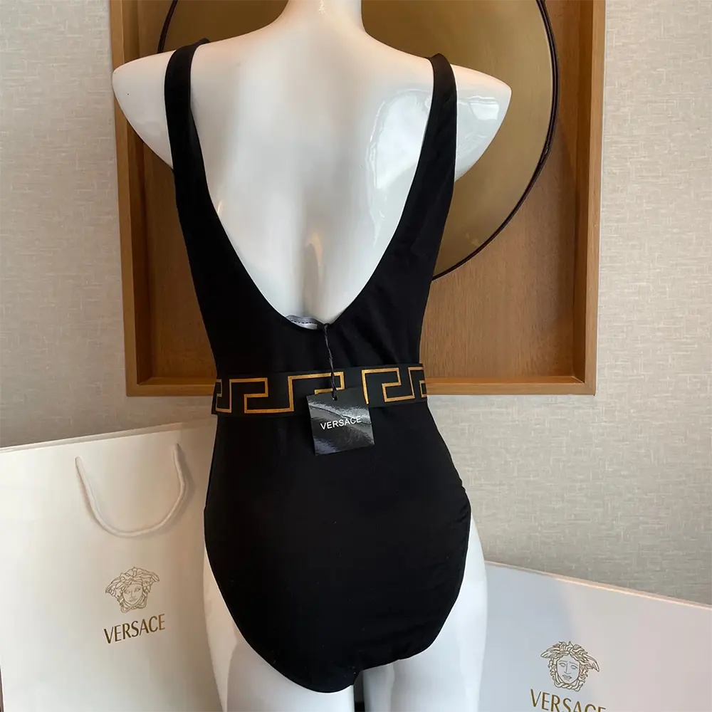 Side profile highlighting silhouette of Versace Women Greca Border Swimsuit