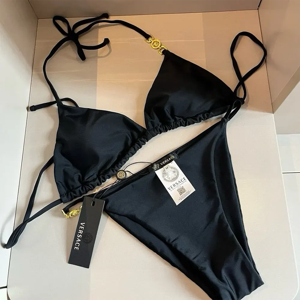 Close-up of gold Medusa hardware on Versace Women Medusa 95 Bikini Bottoms