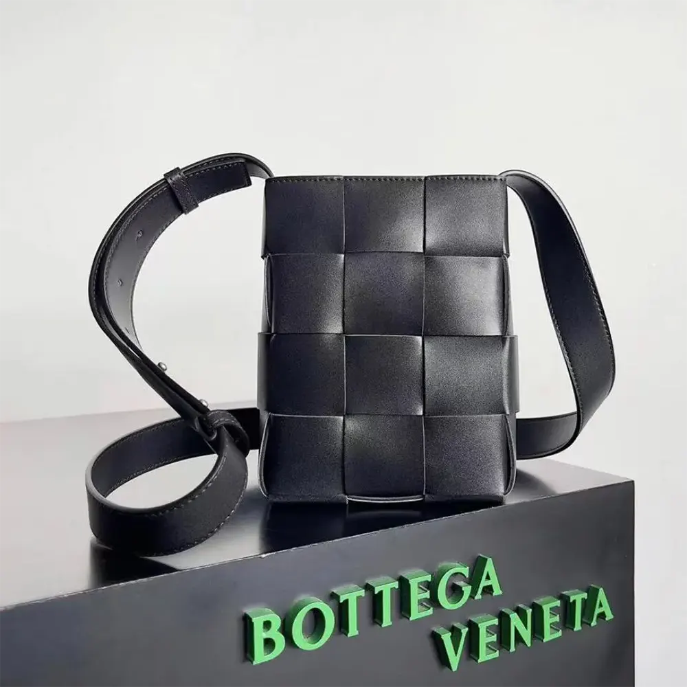 Close-up of black intrecciato weave detail on Bottega Veneta Mini Cassette bag