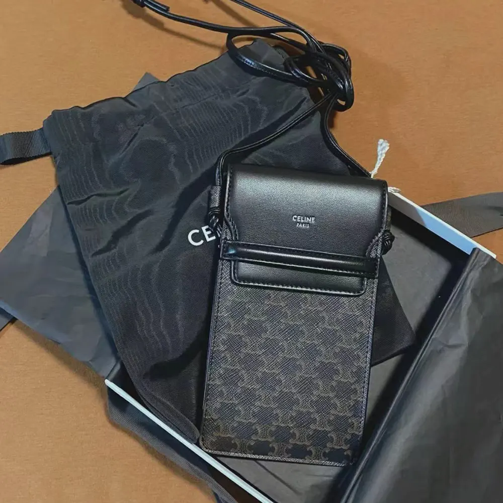 Close-up of gold-tone hardware on Celine Women Phone Pouch with Flap