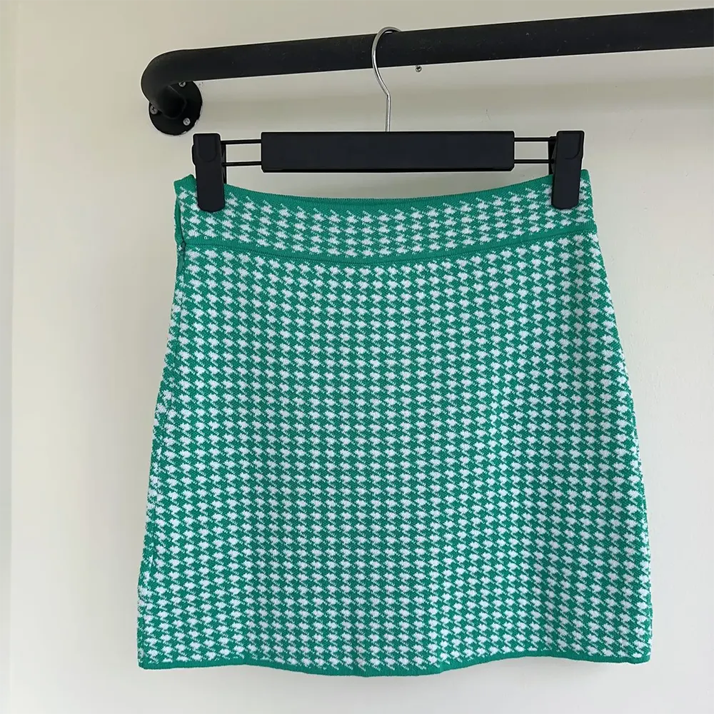 Side angle showcasing flare and fabric texture of Dior Women Dioriviera Miniskirt